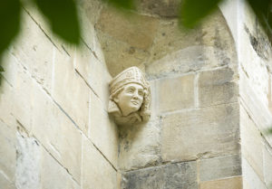 The completed Hugh Faringdon head-stop carving on the Abbey Gateway