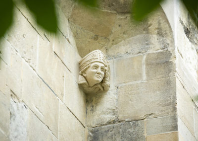 The completed Hugh Faringdon head-stop carving on the Abbey Gateway