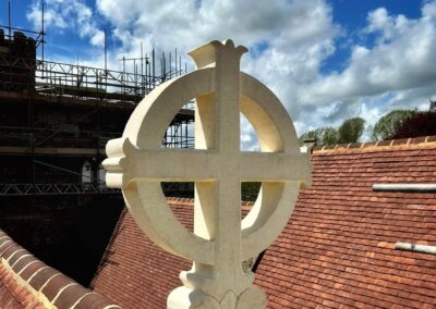 New roof finial crosses were hand carved by Cliveden Conservation for the restored church tower.