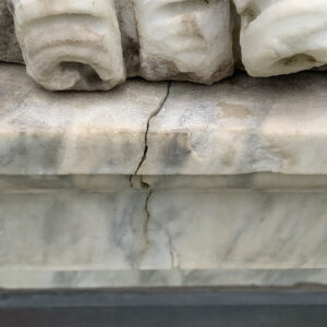 Close up cracked marble on statue.