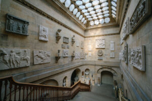 Hallway with statues and reliefs.