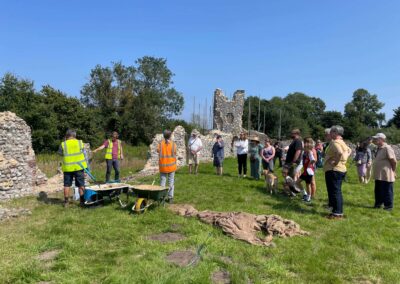 People watching stonemasons at work
