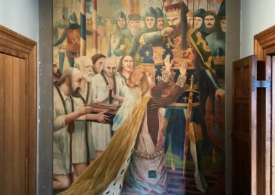 Full view of the Burghers of Calais wall painting in situ in the entrance hall at Plumpton House, before conservation treatment.