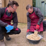 Mixing lime mortar in a bucket